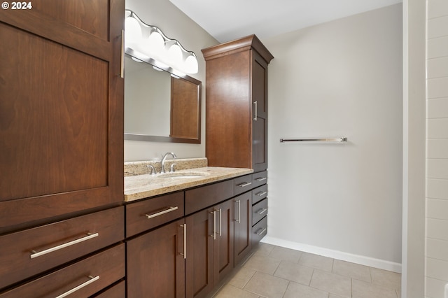 bathroom featuring tile patterned flooring and vanity