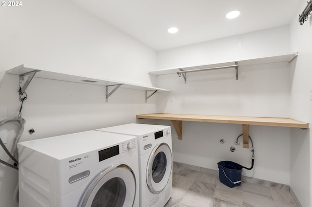 laundry room featuring separate washer and dryer