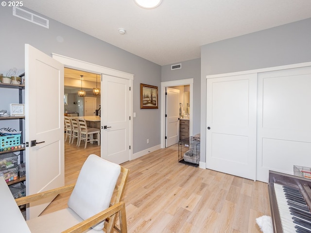 office with light hardwood / wood-style floors