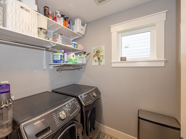 laundry room with independent washer and dryer