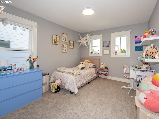 bedroom featuring light colored carpet