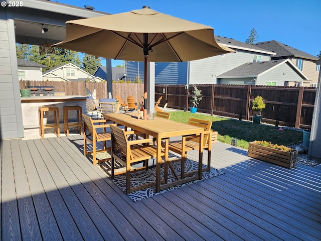 wooden terrace featuring a bar