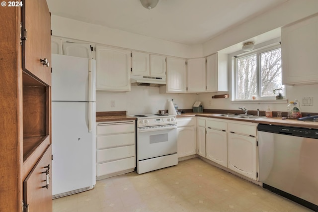 kitchen featuring white appliances, white cabinetry, and sink