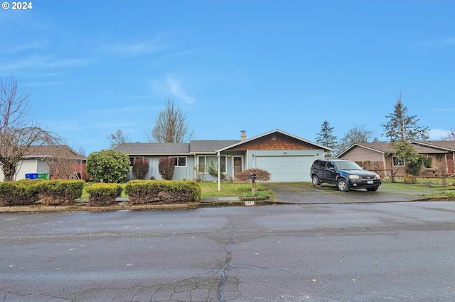 ranch-style house featuring a garage