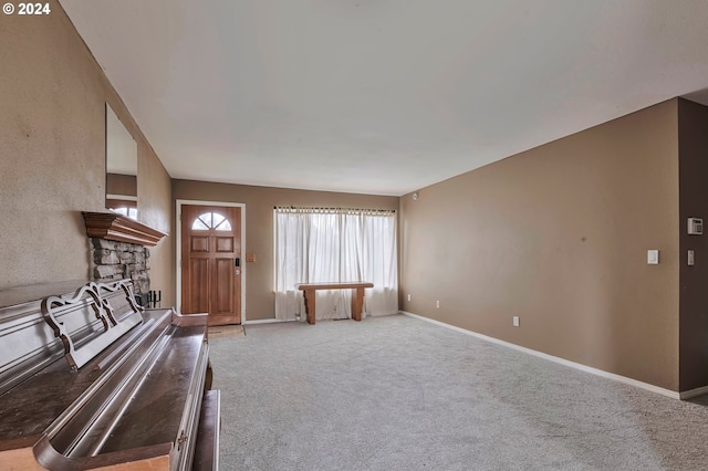 unfurnished living room featuring carpet