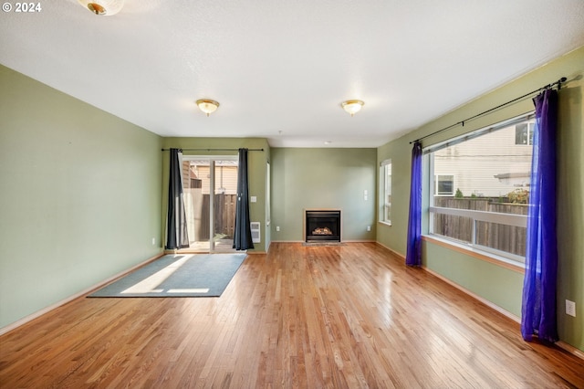 unfurnished living room featuring light hardwood / wood-style flooring