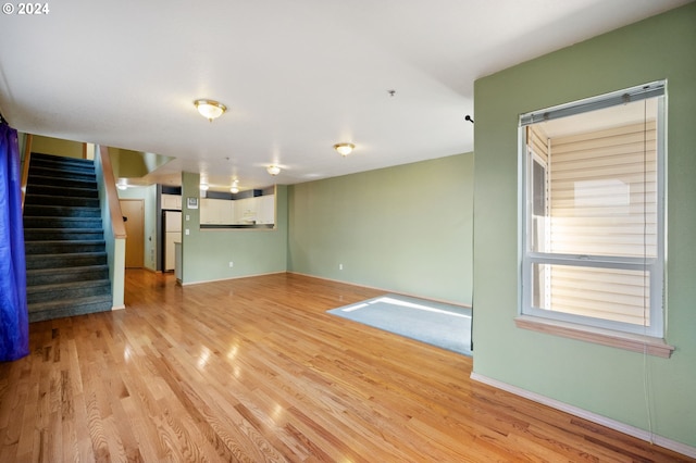 unfurnished living room with light wood-type flooring