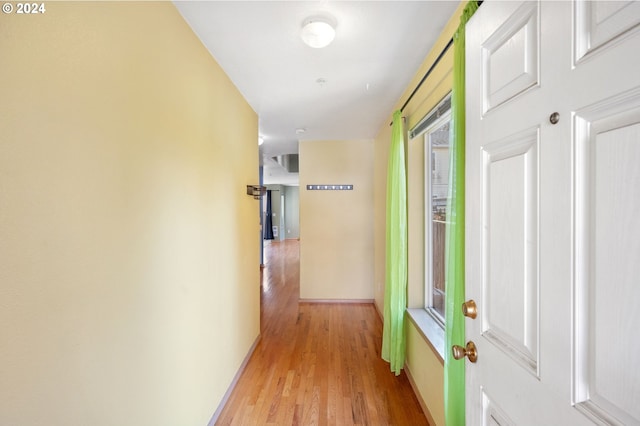 corridor featuring light hardwood / wood-style floors