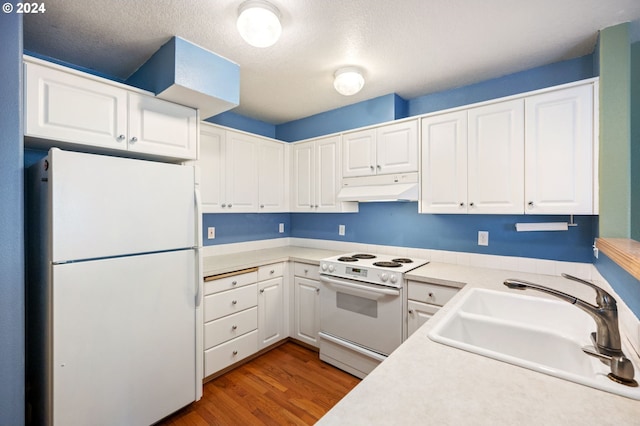 kitchen featuring sink, white cabinetry, light hardwood / wood-style flooring, and white appliances