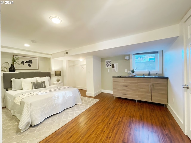 1035 NE Killingsworth St, Portland, OR 97211 - bedroom featuring dark wood-style flooring, baseboards, and recessed lighting