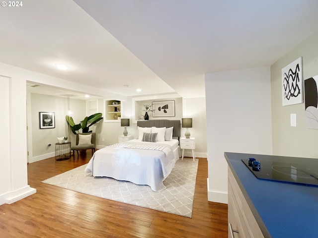 1035 NE Killingsworth St, Portland, OR 97211 - bedroom featuring wood finished floors, baseboards, and recessed lighting