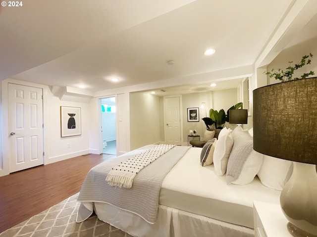 1035 NE Killingsworth St, Portland, OR 97211 - bedroom with dark wood finished floors, baseboards, and recessed lighting
