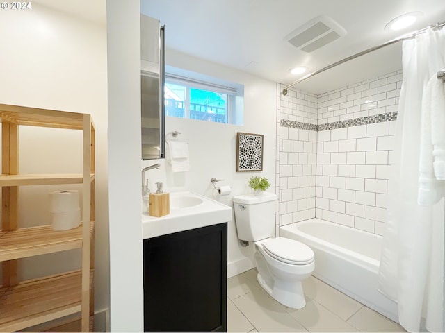 1035 NE Killingsworth St, Portland, OR 97211 - bathroom with toilet, vanity, tile patterned floors, and shower / bath combo with shower curtain