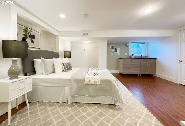 1035 NE Killingsworth St, Portland, OR 97211 - bedroom featuring wood finished floors, recessed lighting, and baseboards