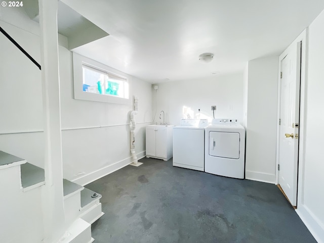 1035 NE Killingsworth St, Portland, OR 97211 - washroom featuring washing machine and clothes dryer and baseboards