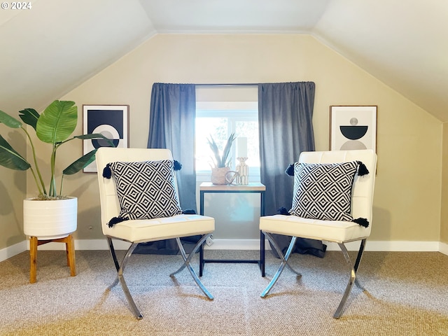 1035 NE Killingsworth St, Portland, OR 97211 - sitting room with vaulted ceiling, carpet floors, and baseboards