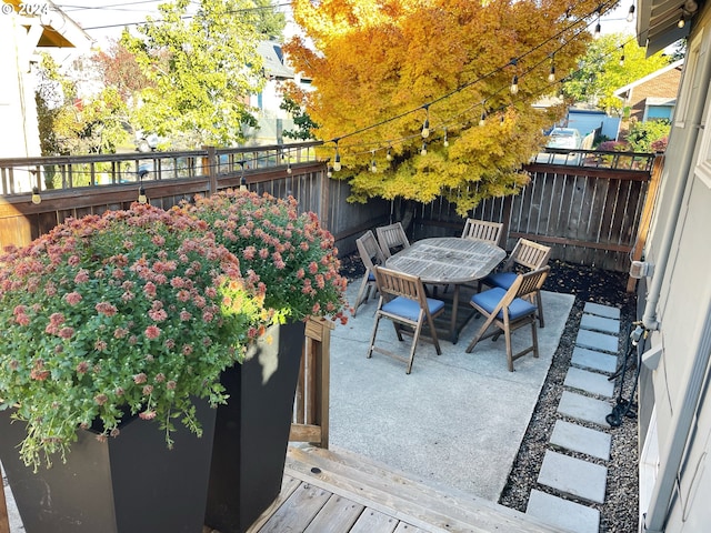 1035 NE Killingsworth St, Portland, OR 97211 - deck with a fenced backyard, outdoor dining area, and a patio