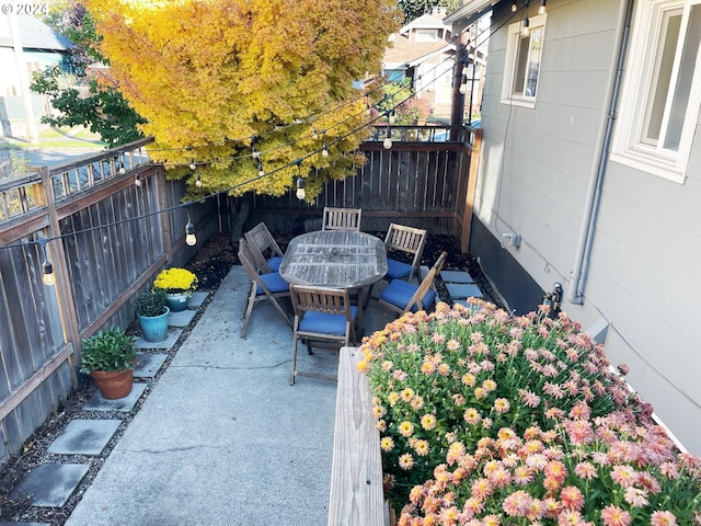 1035 NE Killingsworth St, Portland, OR 97211 - view of patio with outdoor dining space and a fenced backyard