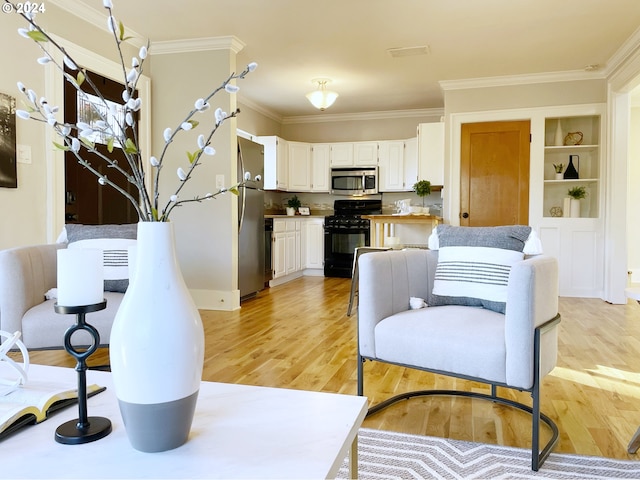 1035 NE Killingsworth St, Portland, OR 97211 - living area featuring crown molding, light wood-style floors, and built in features