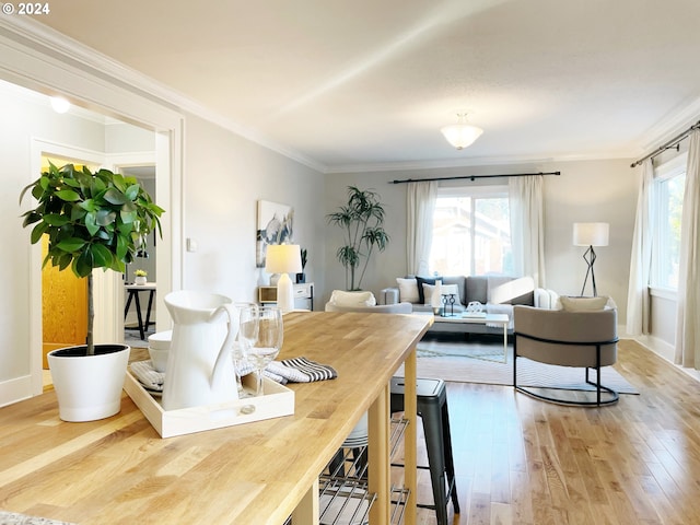 1035 NE Killingsworth St, Portland, OR 97211 - dining room featuring wood finished floors and crown molding