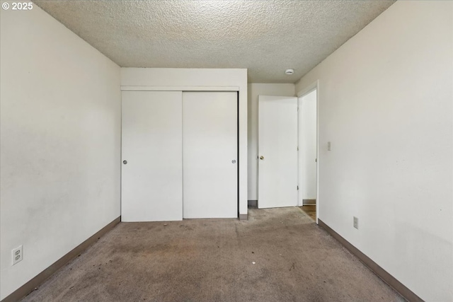 18495 SW Springfield St, Beaverton, OR 97078 - unfurnished bedroom with a closet, a textured ceiling, carpet floors, and baseboards