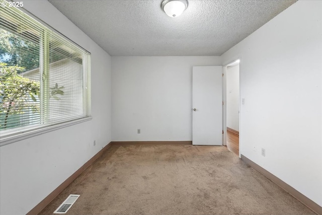 18495 SW Springfield St, Beaverton, OR 97078 - carpeted empty room with a textured ceiling and baseboards