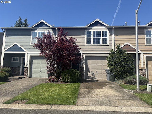 834 NW 3rd Ave, Canby, OR 97013 - view of front of home with an attached garage, concrete driveway, and stone siding