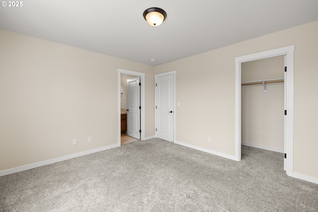 834 NW 3rd Ave, Canby, OR 97013 - unfurnished bedroom featuring light colored carpet, a spacious closet, a closet, and ensuite bath