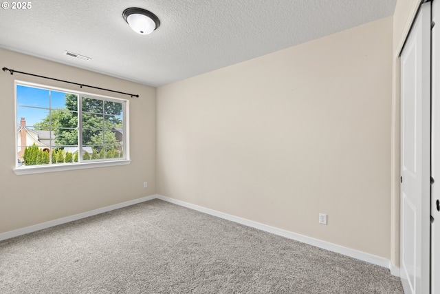 834 NW 3rd Ave, Canby, OR 97013 - carpeted empty room with a textured ceiling and baseboards