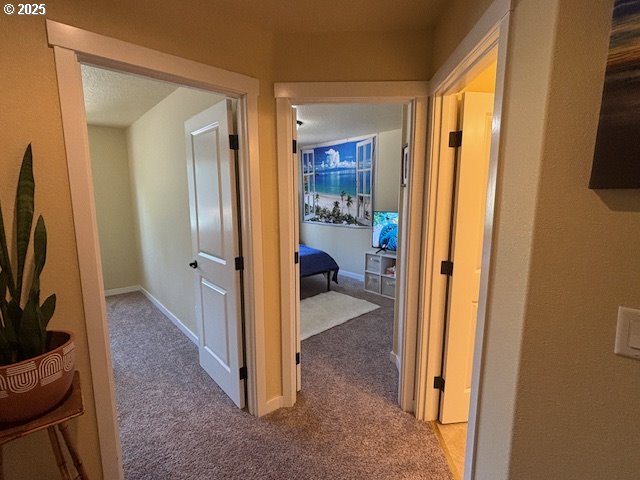 834 NW 3rd Ave, Canby, OR 97013 - corridor featuring carpet floors and baseboards