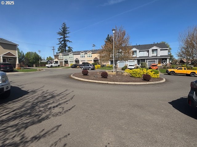 834 NW 3rd Ave, Canby, OR 97013 - view of asphalt road with a residential view and street lights