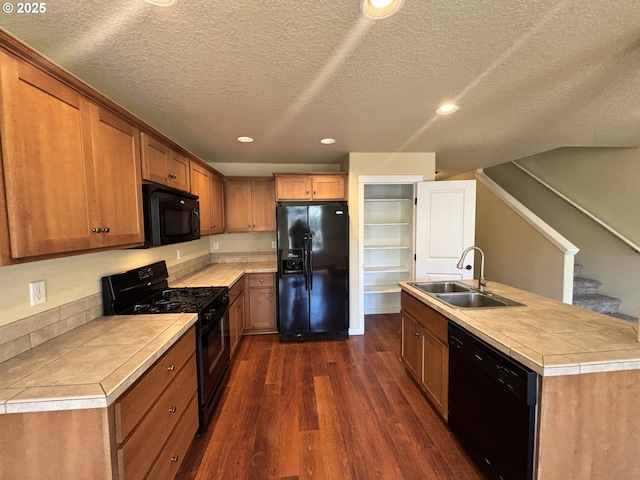834 NW 3rd Ave, Canby, OR 97013 - kitchen featuring black appliances, a sink, dark wood-type flooring, recessed lighting, and a textured ceiling
