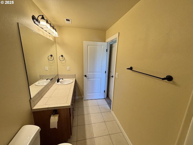 834 NW 3rd Ave, Canby, OR 97013 - half bath featuring toilet, tile patterned flooring, vanity, and baseboards