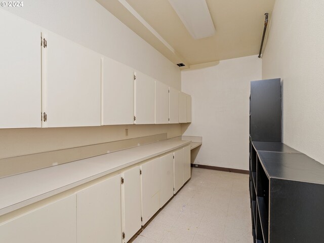 kitchen featuring white cabinets