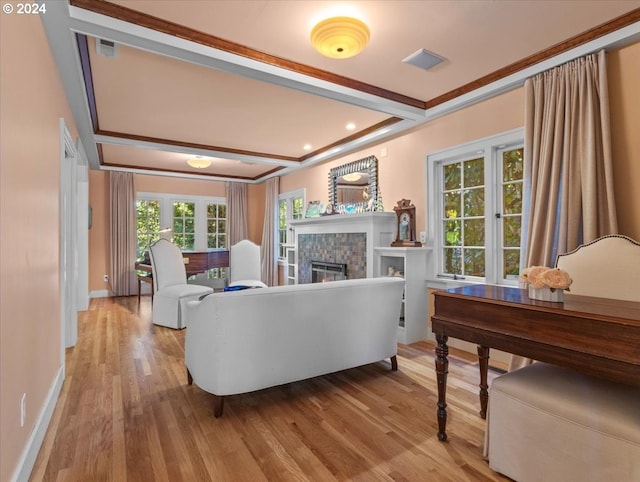 living room with crown molding and hardwood / wood-style flooring