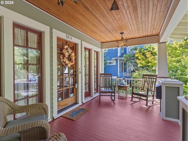 wooden terrace featuring a porch