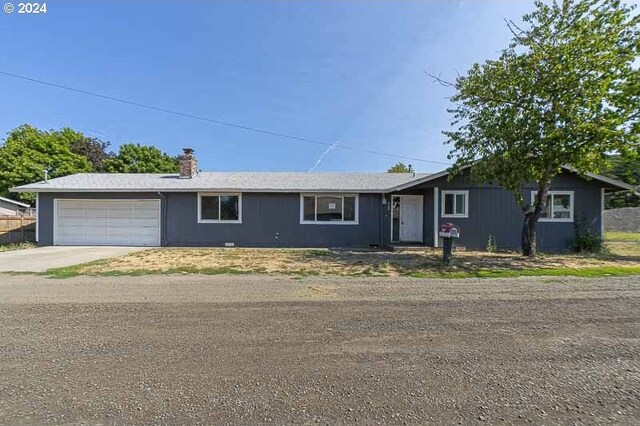 single story home featuring a garage