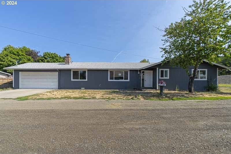 single story home with a garage