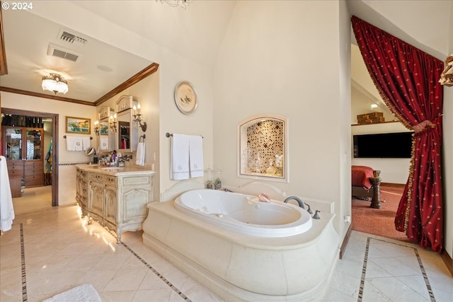 bathroom with a tub, tile patterned flooring, crown molding, and vanity