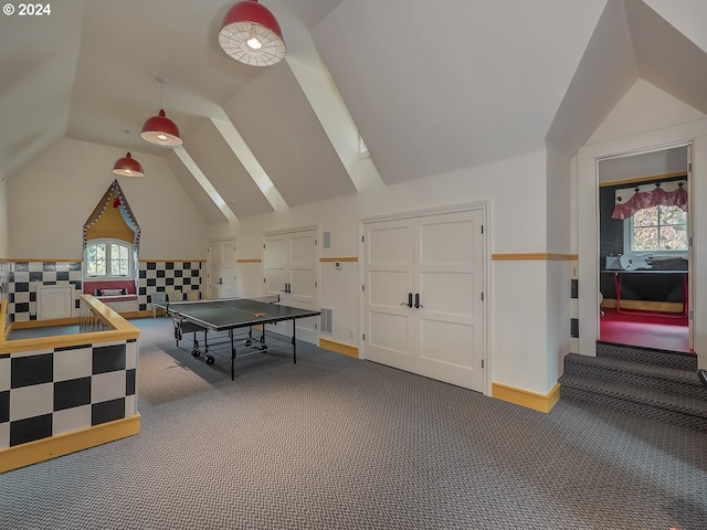 rec room with lofted ceiling, carpet, visible vents, and baseboards