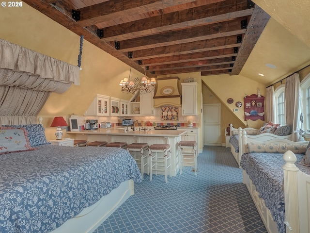 bedroom featuring vaulted ceiling with beams, dark carpet, a sink, and a notable chandelier