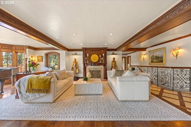 living room with light hardwood / wood-style flooring and ornamental molding