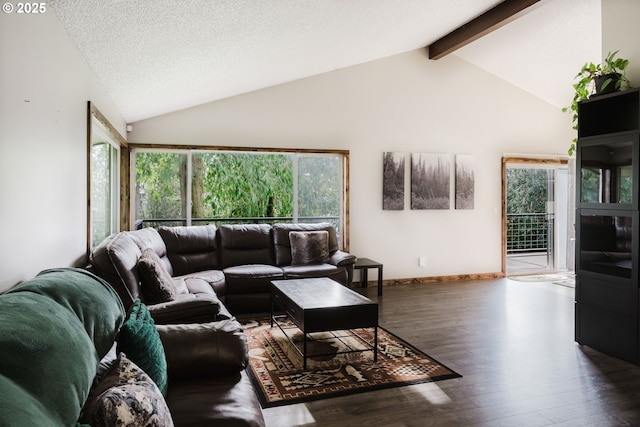 living room with vaulted ceiling with beams, a textured ceiling, baseboards, and wood finished floors