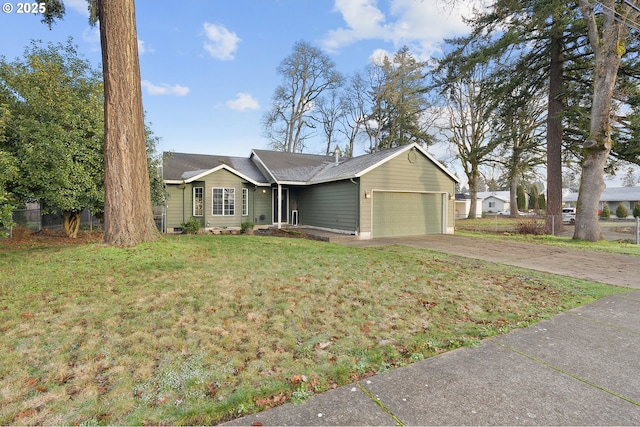 ranch-style house featuring a front yard and a garage