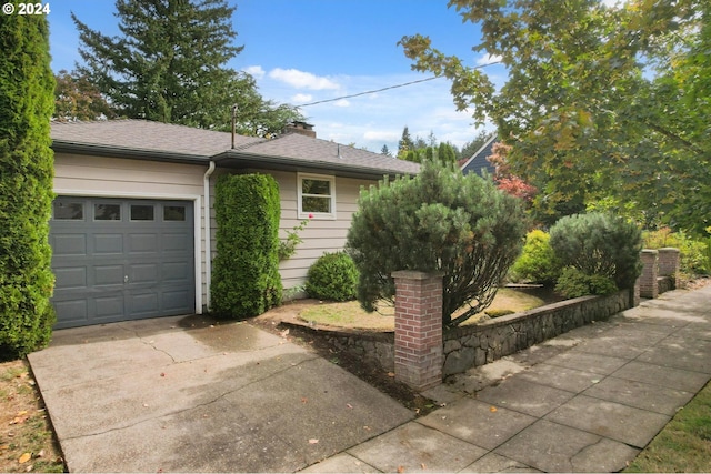 view of property exterior with a garage