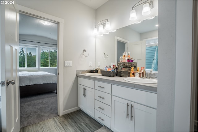 bathroom featuring vanity and hardwood / wood-style flooring