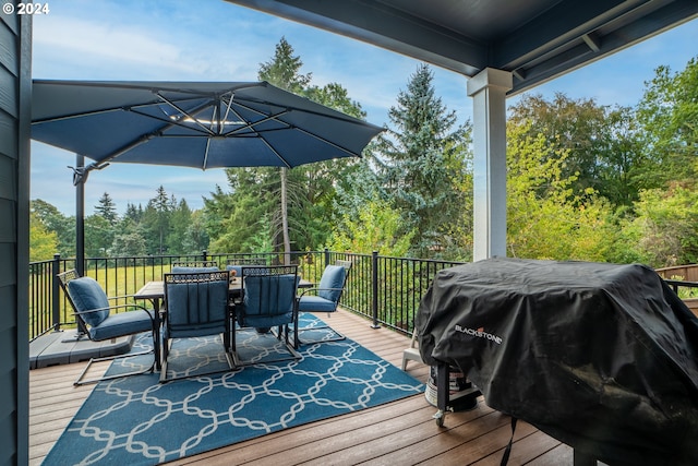 wooden terrace with a grill