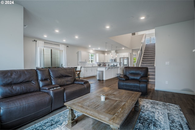 living room featuring dark wood-type flooring