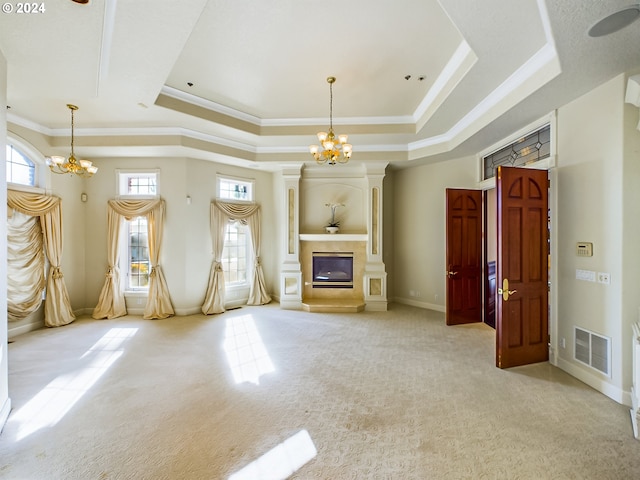 unfurnished living room with light carpet, a raised ceiling, and a chandelier