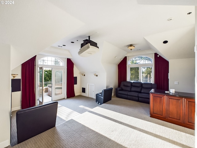 additional living space with lofted ceiling and light carpet